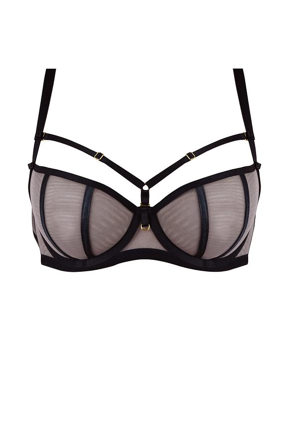 Efektowny biustonosz miękki o kroju balkonetki, miseczki wykonane z czarnej siatki, na którą naszyta została siatka w kolorze mokka.
Satynowe lamówki przykrywają pionowe cięcia.
Konstrukcja doskonale wyeksponuje biust a ozdobne paseczki pięknie ozdobią dekolt, ozdobne paseczki w dekolcie odpinają się.
Skład surowcowy: 85% Poliamid, 10% Elastan, 5% Poliester