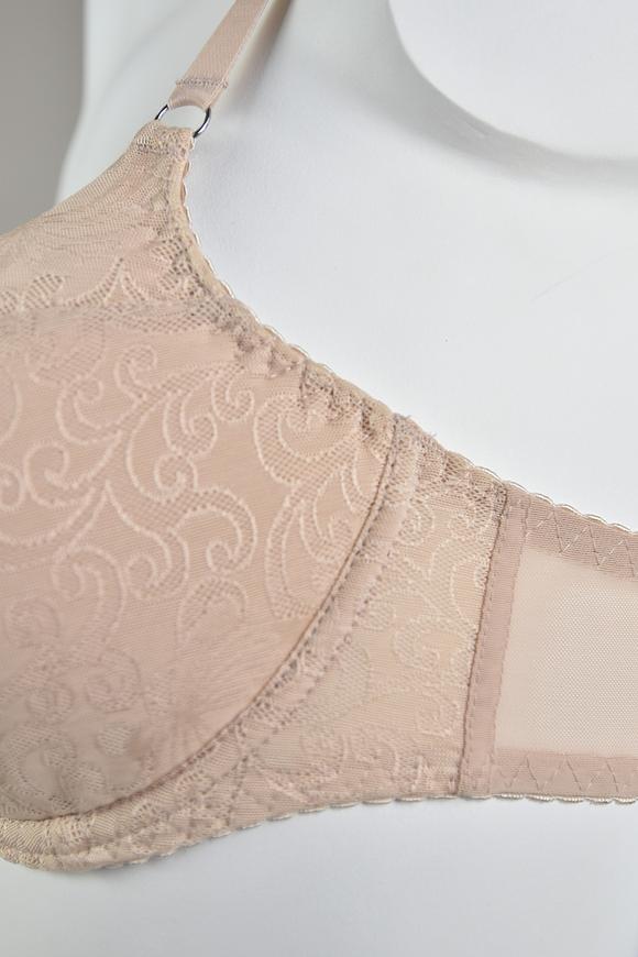 Biustonosz cały usztywniony. Miseczki pokryte gładkim plenem. 
Biustonosz sprawdzi sie na średnim i dużym biuście, okala i unosi piersi a usztywnienie zarówno górnej jak i dolnej miseczki zapewni doskonały kształt piersi w każdej kondycji.
Ramiączka regulowane, nieodpinane. 
Skład surowcowy: 88%Poliamid, 8%Bawełna, 4%Elastan